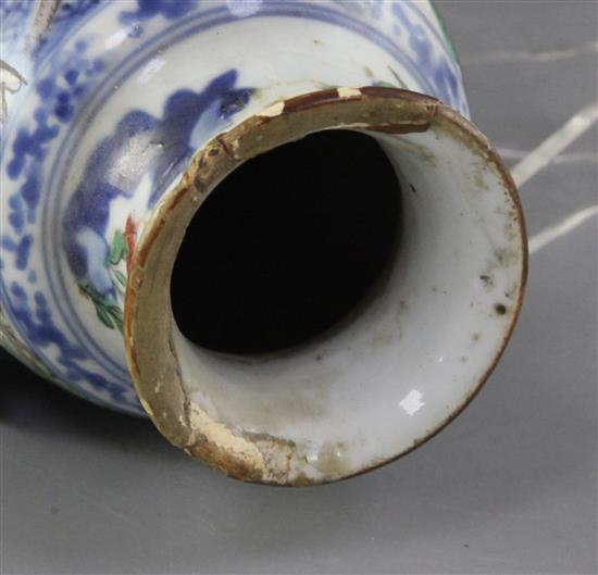 A Chinese wucai slender cylindrical vase and cover, late 17th century, height 24.5cm, old discoloured repairs to rim